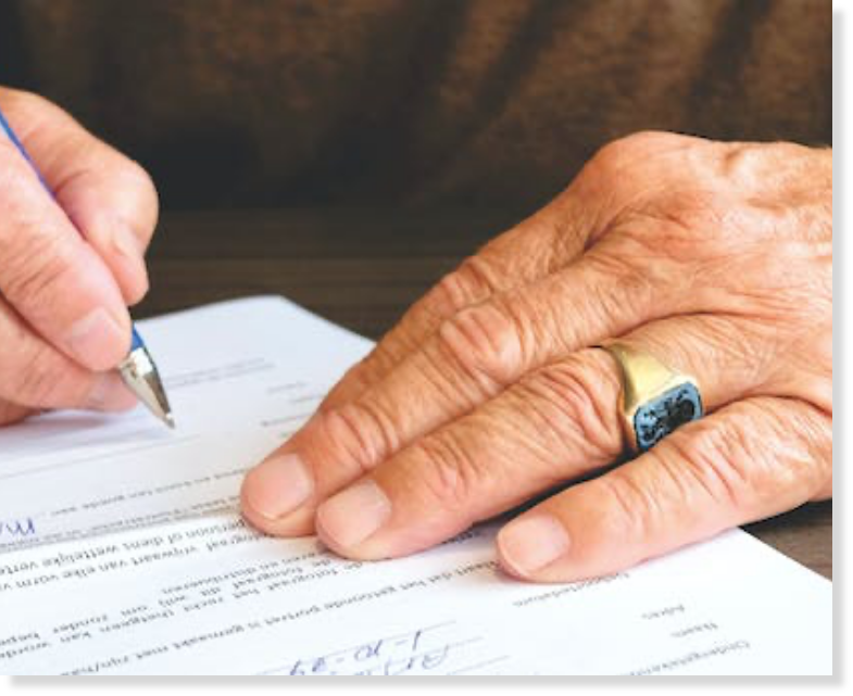 Man signing document
